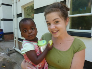 Chaelena holds one of the youngsters at Bethany Home.