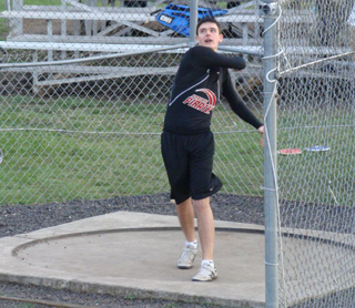 Kyle Uhlenkott lets fly with the discus. Photo by Kayla Raymond.