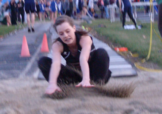 MaKayla Schaeffer hits the pit in the triple jump last Thursday at Kamiah. She won the event. Photo by Kayla Raymond.