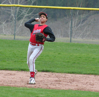 Tyler Hankerson makes a throw from shortstop.
