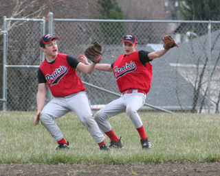 Second baseman Garrett Schmidt checks his glove for the ball (it was there) after he and rightfielder Tayler Heitman nearly collided on a popup in the CV game.