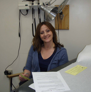 Kristy Fresh, SMHC/CVHC Director of Physician Clinics, is pictured with some of the materials being distributed to explain the new Medicare Wellness Visit benefit.