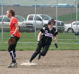 Megan Sigler turns second and heads for third on a third inning triple in the first Troy game.