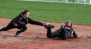 Haleigh Schmidt makes a headfirst slide into second to avoid the tag on a stolen base attempt.