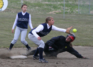 Savanah Prigge slides into second well ahead of the tag with a stolen base.