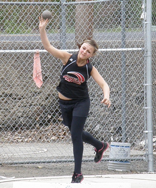 Taylor Heitman competes in the shot put at Lapwai. She took second in the event and won the discus.