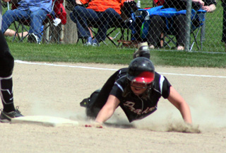 Haleigh Schmidt makes a headfirst dive into second for a stolen base against Troy in the championship game.