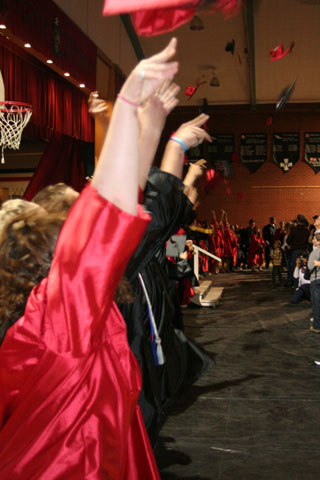 The mortarboards go flying as graduation ceremonies were completed