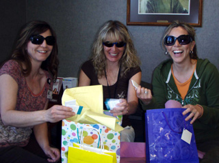 Packing the free goody bags for the July 19th SMHC Fun in the Sun Ladies Night Out are Kim Stubbers, Kelly Williams and Lisa Hasselstrom.