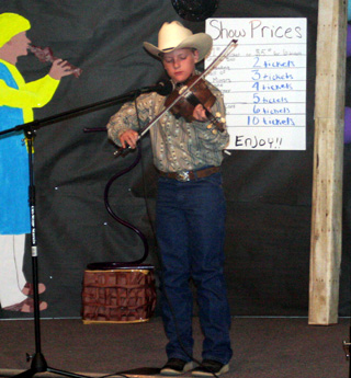 Elliot Marks, who played Orange Blossom Special as part of his performance won the 5-12 year old portion of the 2-Minute Talent Show.