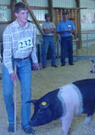Isaiah Shears with his reserve champion hog. Photo provided by Vicki Shears from judging as he was at his sisters wedding during the sale.