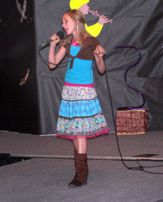 Lauren Stubbers prevailed over several technical problems to win the 13-18 year old portion of the 2-Minute Talent Show.