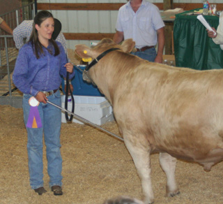 Selena Davila with the grand champion quality steer.