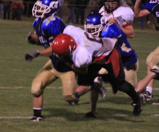 Dakota Wilson tackles a Genesee ballcarrier.