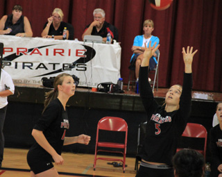 Tyler Workman watches Monica Lustig make a set in the match against Summit.