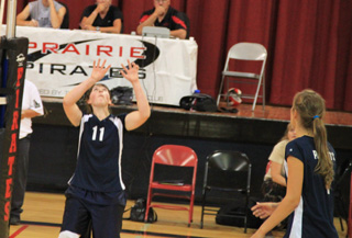 Nicole Frei gets ready to make a set while Savanah Prigge, right gets ready to make a spike in Summits match against Genesee.
