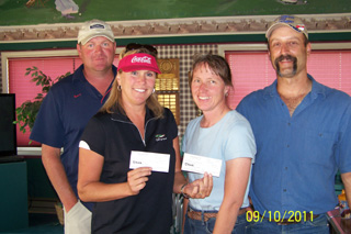 Taking first place at the Prairie Booster Club Golf Scramble was the team of, from left, Bryan and Becky Higgins and Lynn and Greg Danly. Photo provided by Chris Kaschmitter.