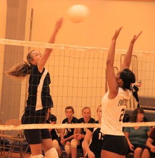 Savanah Prigge spikes the ball against Asotin.
