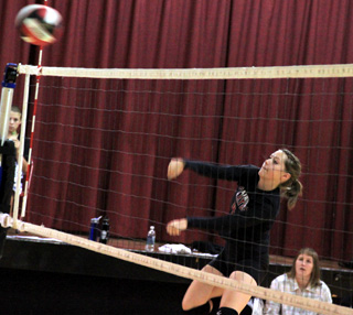 Megan Sigler spikes the ball in the Kendrick match.
