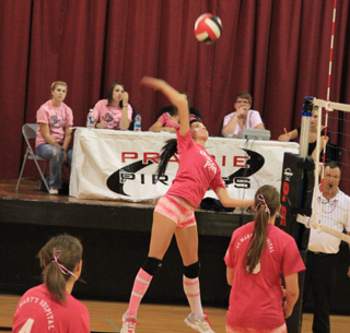 Sam Poxleitner goes for the kill as Megan Sigler, left, and MeShel Rad watch.