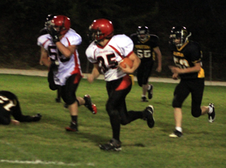 Cody Schumacher heads upfield escorted by Josh Roeper for what turned into a 72 yard touchdown run.