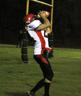 Justin Schmidt, in his first game back from injury, catches a touchdown pass as the first half ends.