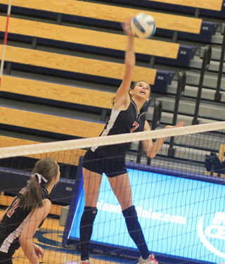 Sam Poxleitner goes for the kill against Kendrick. Also shown is Tyler Workman.