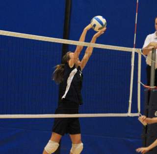 Savanah Prigge makes a game ending block against Timberline at Distict.