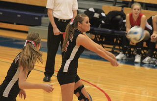 MeShel Rad makes a pass as Tanna Schlader watches.