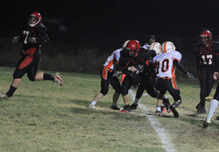 Josh Roeper crosses the goal line for a 2-point conversion. At left is Devon Watton who lined up in front of Roeper as fullback on the play. At right is Tyler Hankerson, 17.