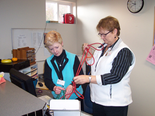 Judy DeHaas and Ginny Acheson from St. Marys Hospital Physical Therapy are loading up some resistance bands which will used in the Seniors in Shape program as part of their strength and balance training.