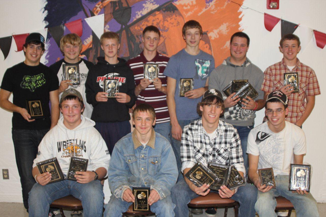 Troy Lorentz tries to evade a tackler as he carries the ball.