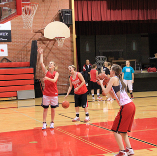 Players participates in a shooting and endurance drill during practice Monday. Shown are Tanna Schlader, Taylor Heitman and MaKayla Schaeffer.
