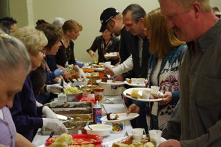 Some of the crowd going through the food line at the Brats & Brew.