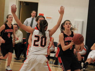 Shelby VonBargen looks to shoot just before the halftime buzzer in the Kendrick game. At left is Tanna Schlader who fed her the ball.