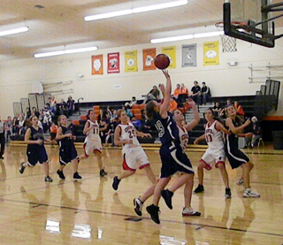 Brooke Schumachergoes for a shot at the New Meadows Tournament. Photo by Julie Schumacher.