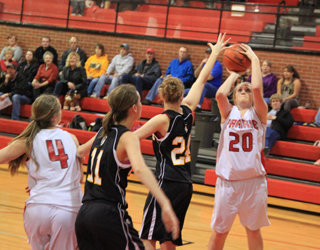 Kendall Schumacher puts up a shot. At left is Tanna Schlader.