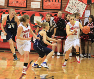 MeShel Rad heads upcourt after stealing the ball against Grangeville. At left is Megan Sigler.