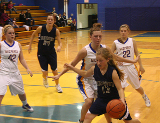 Nicole Wemhoff dribbles past a Nezperce defender. In the background is Savanah Prigge. Photo by Steve Wherry.