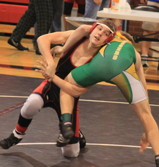 Alex Duman pulls in a leg as he attempts to get Potlatchs Todd Marshall down on the mat.