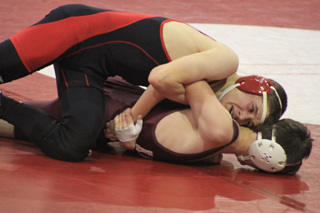 Kade Perrin hooks an arm on Dillon Wilcox of Kamiah as he attempts to turn him over for the pin.