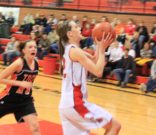 MaKayla Schaeffer goes for a transition lay-up as a Troy defender tries to distract her.