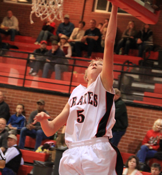 Marucs Higgins scores a lay-up against C.V.