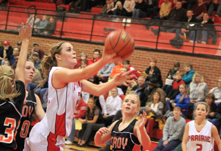 MeShel Rad goes for 2 of her game-high 20 points against Troy. At right is Callie Mader.