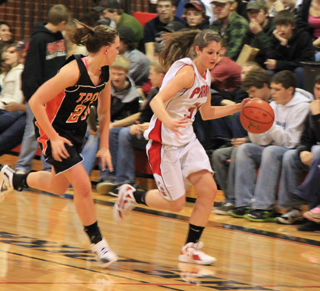 Shelby VonBargen brings the ball upcourt after a steal against Troy.