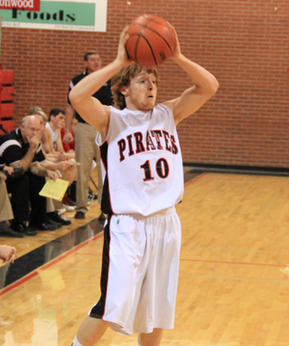 Troy Lorentz looks to pass the ball against C.V.