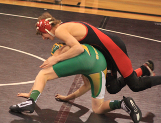 Tyler Ross rides Potlatchs Brandon Miller down to the mat. He wound up winning by pin.