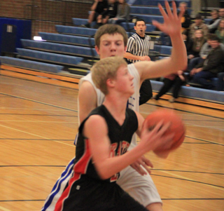 Rhett Schlader goes for a layup at Genesee. He was fouled on the play and converted the 3-point play.