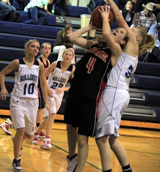 It looks like Tanna Schlader is being fouled on this shot attempt. In the background is Megan Sigler.
