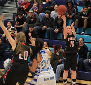 Megan Sigler puts up a 3-pointer against Lapwai as Kendall Schumacher posts up.